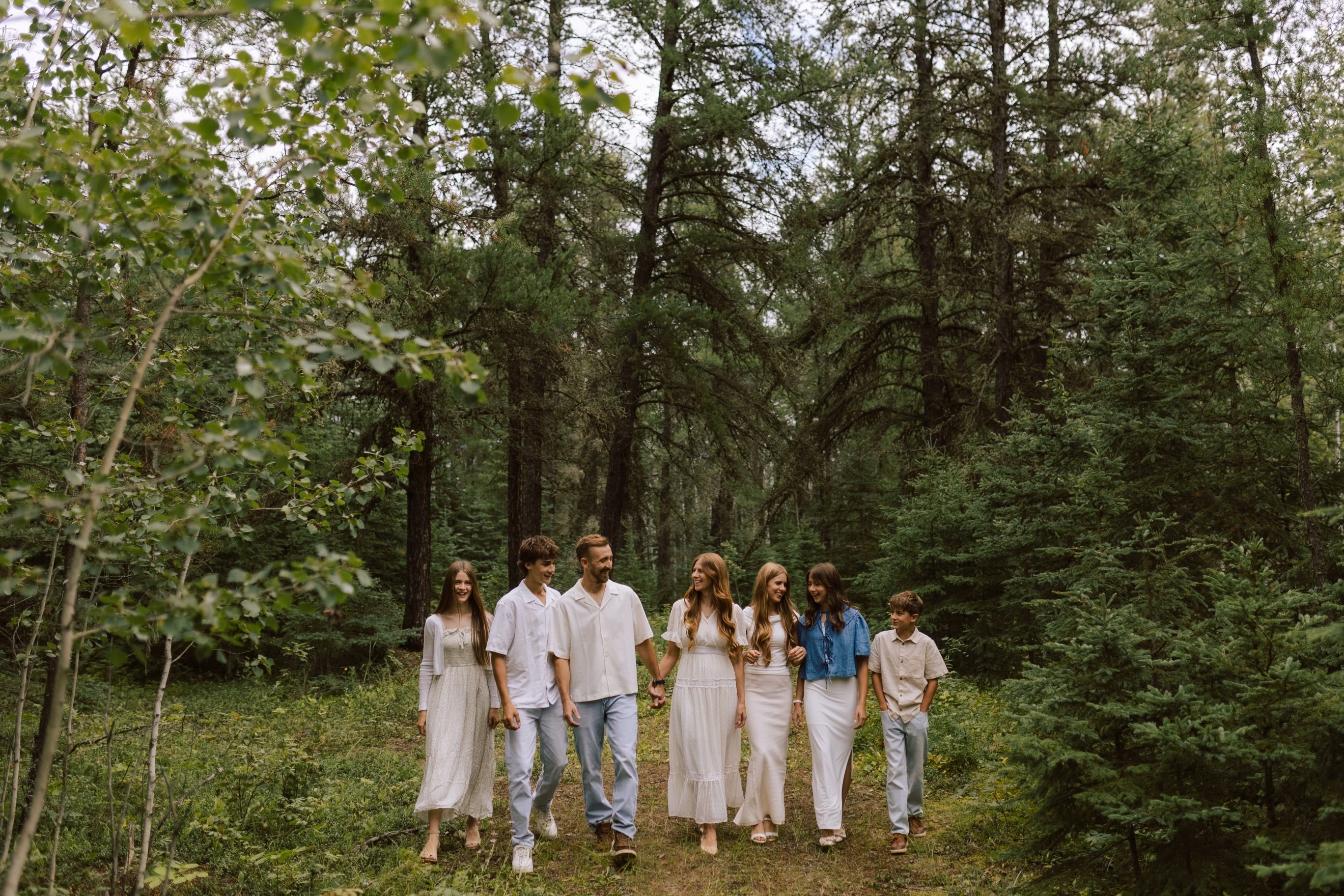 The Giesbrecht Family gathered together in the forest